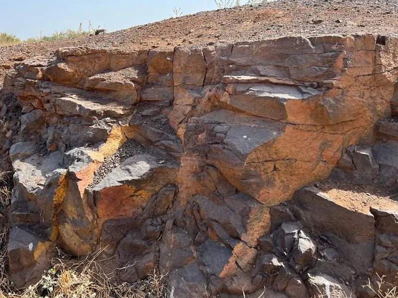 Weathered ore-bearing rock outcrop